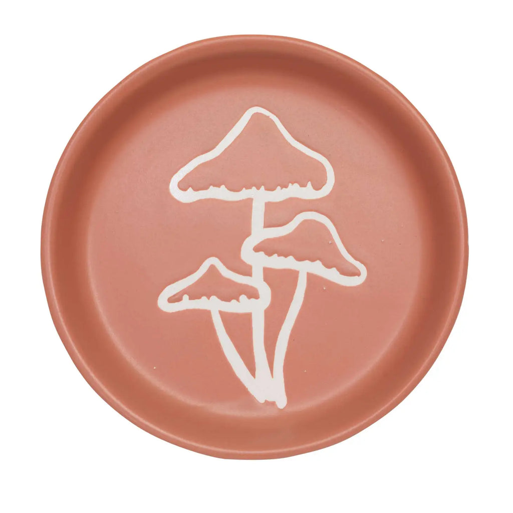 A Mushroom Coaster with a vibrant and fun design, placed on a wooden surface.
