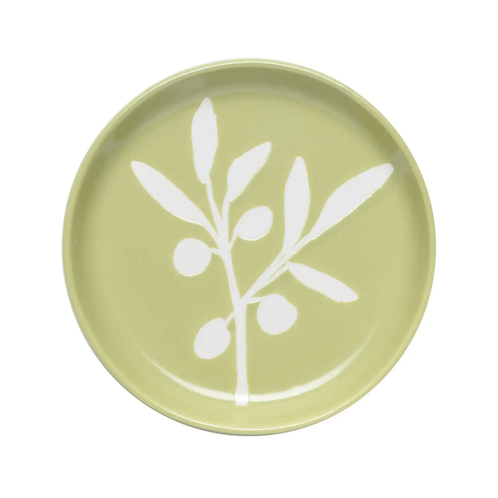 An Olive Branch Coaster with a refined design, on a wooden tabletop.