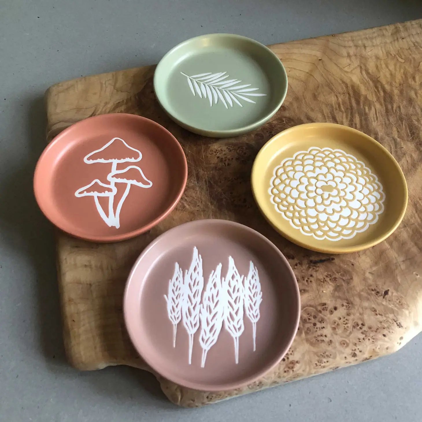 A coaster featuring a beautifully detailed wheat design.