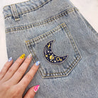Cosmic Moon Patch, showcasing a beautifully designed moon within a cosmic background, symbolizing exploration and mystery.