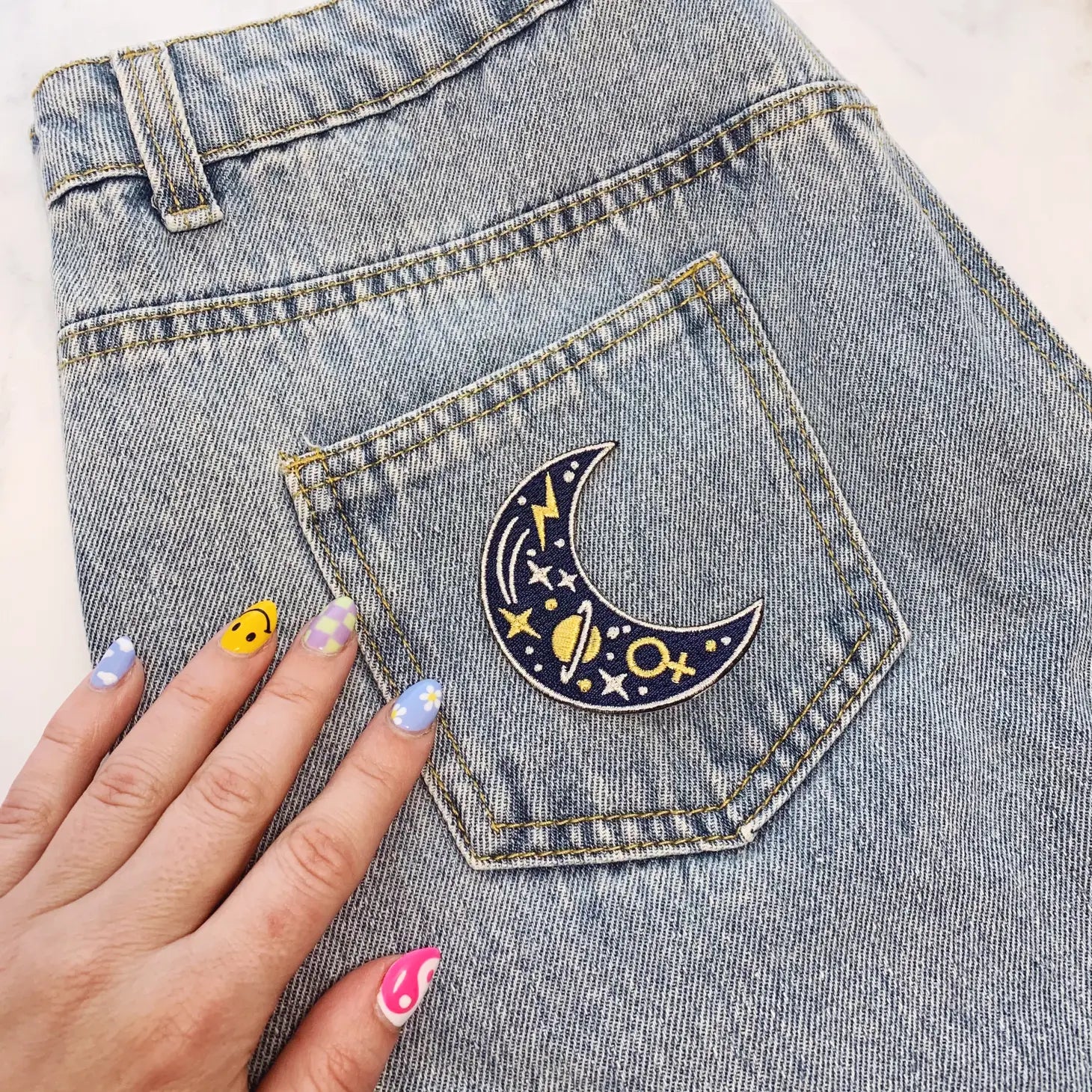 Cosmic Moon Patch, showcasing a beautifully designed moon within a cosmic background, symbolizing exploration and mystery.
