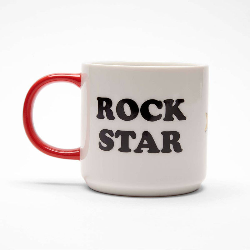 White ceramic mug with a red handle featuring a cool character playing a guitar, surrounded by yellow stars, with "Rock Star" printed on the back.