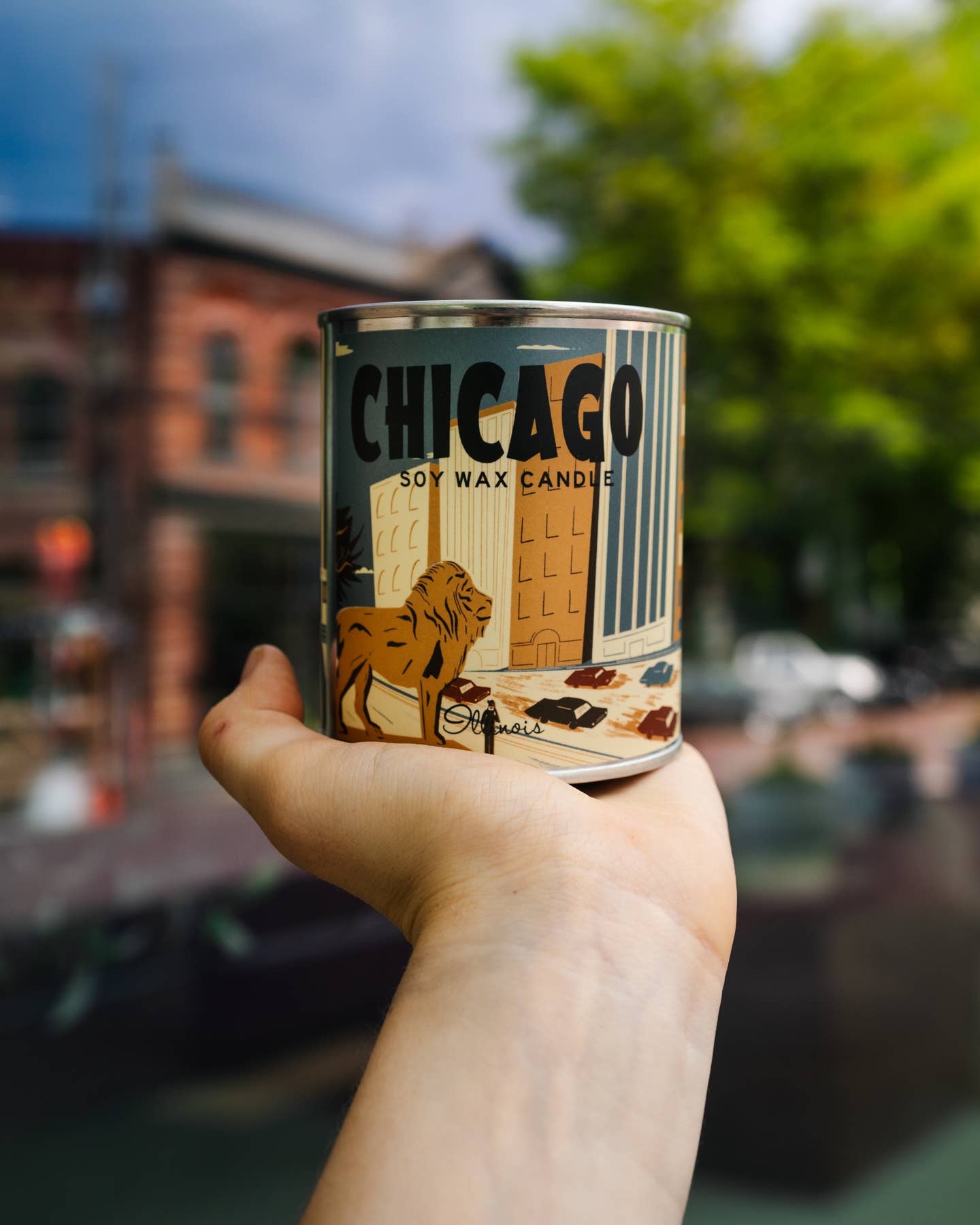 Chicago Candle: A lit candle emanating warmth and comfort, epitome of relaxation.