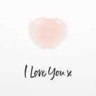 Rose Quartz Greeting Card featuring a small rose quartz heart attached to a card with the text ‘I Love You x’ and a description of rose quartz properties.