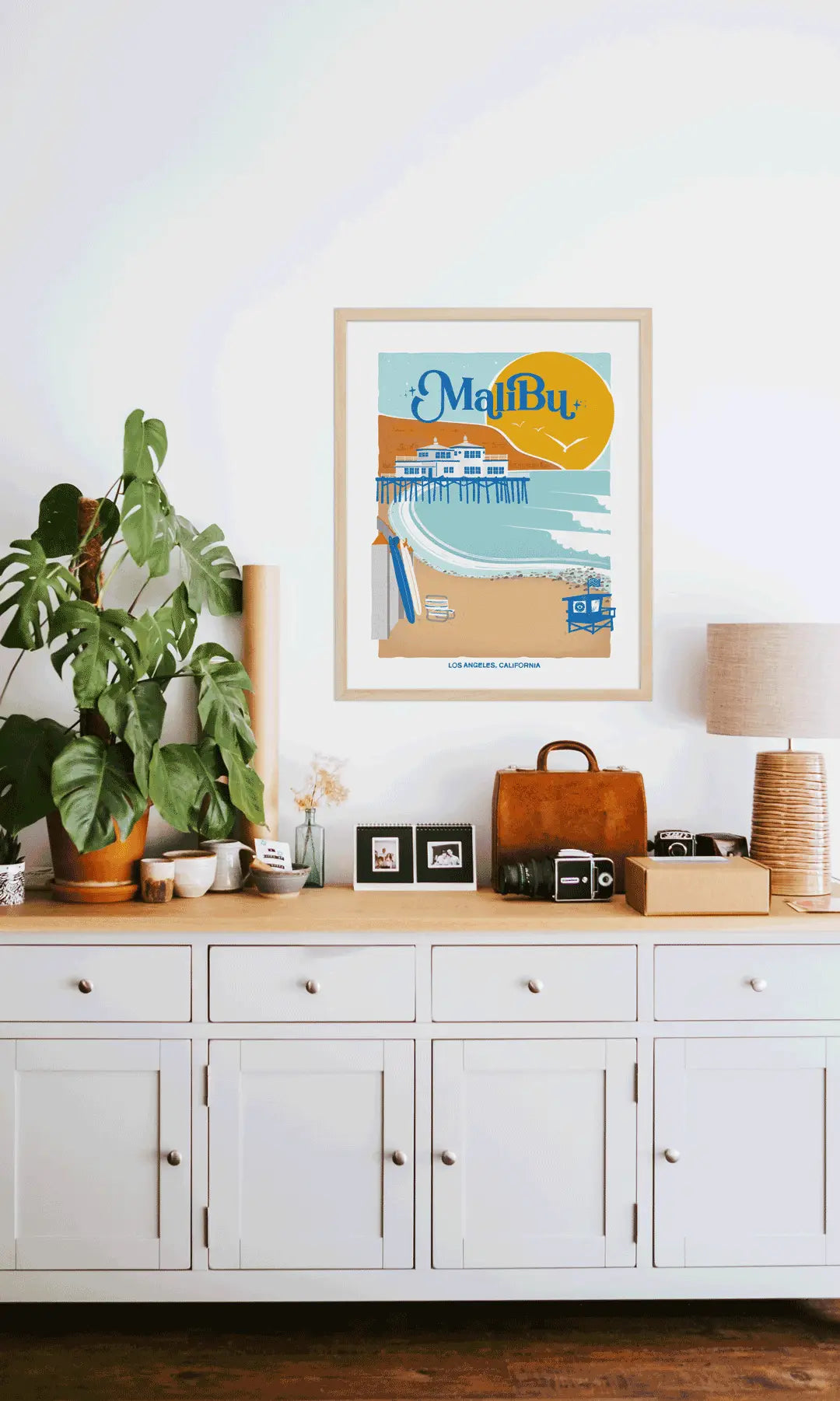 Elegant print illustrating Malibu's pristine beaches, waves, and coastal charm, celebrating its Californian essence.