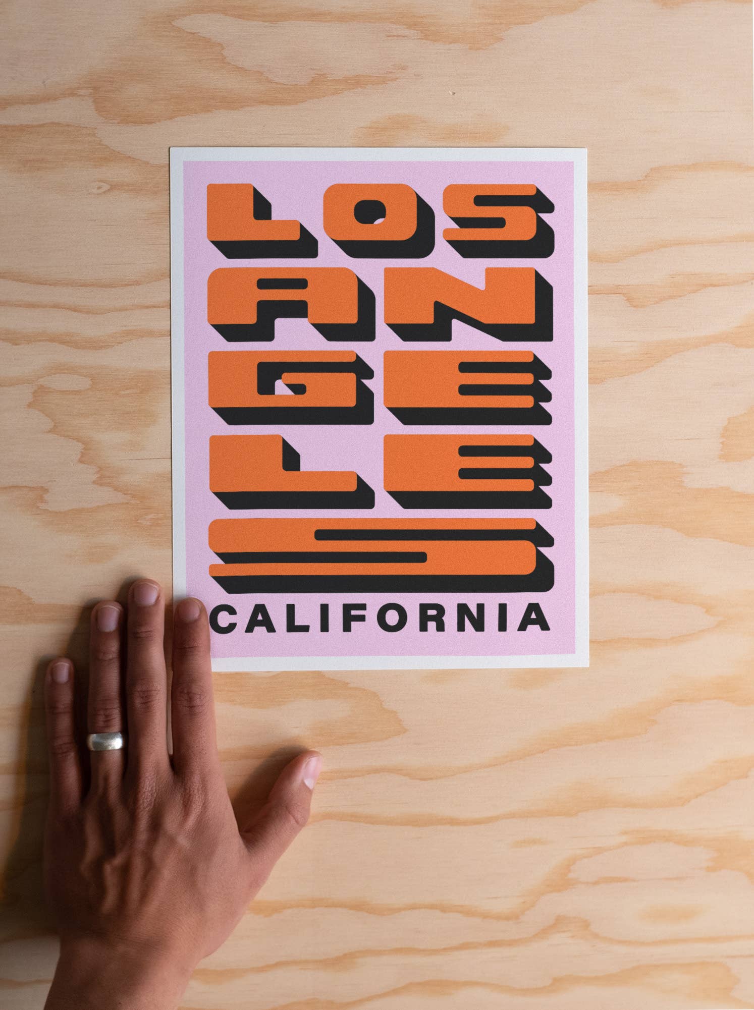 Los Angeles Block Letter Print: A bold print featuring "Los Angeles" in block letters, epitome of urban vibrancy.