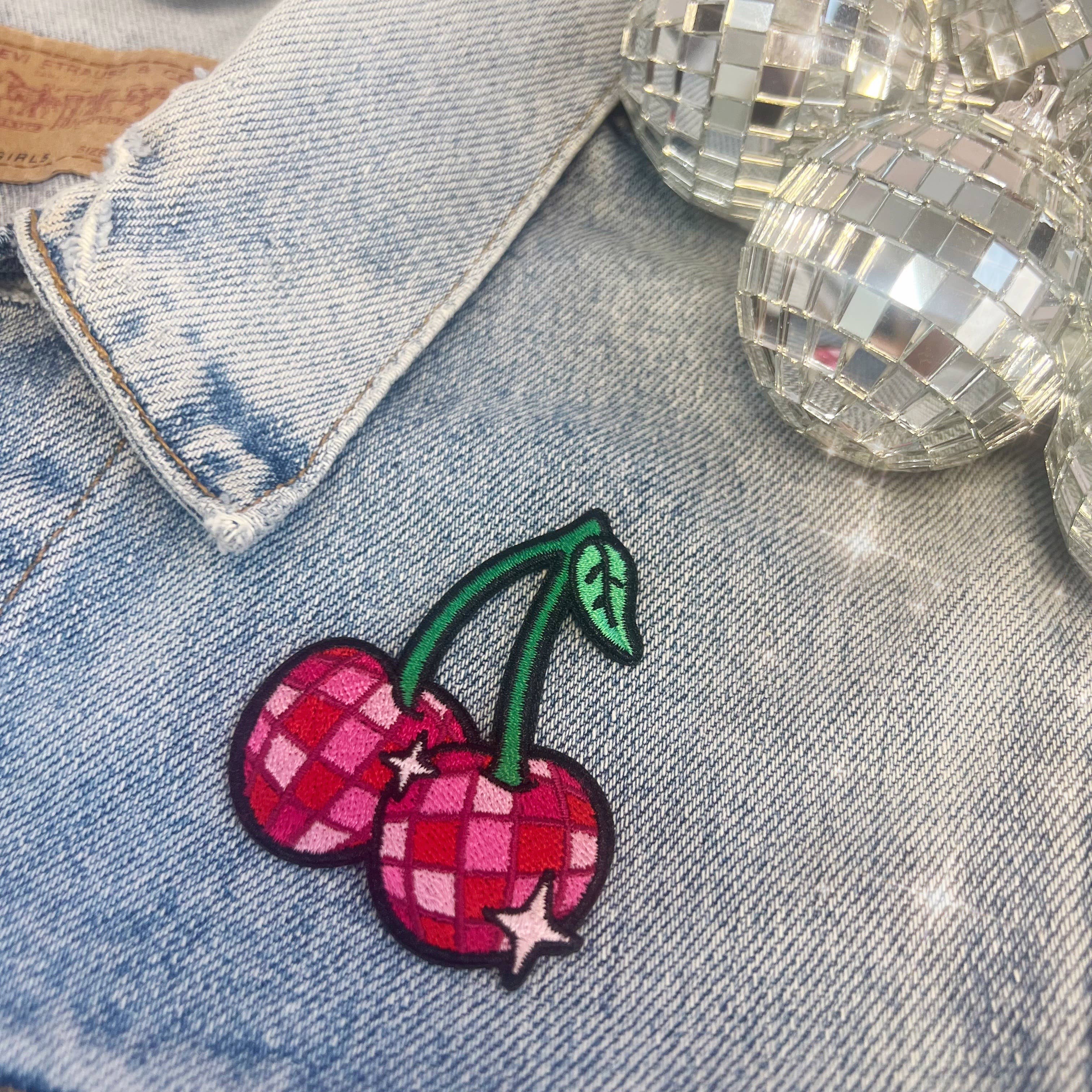 Disco Ball Cherries Patch featuring a pair of cherries designed as shiny disco balls.