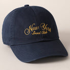 Beige and navy New York Social Club embroidered baseball caps with curved brims.