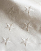 Close-up of textured fabric with star patterns