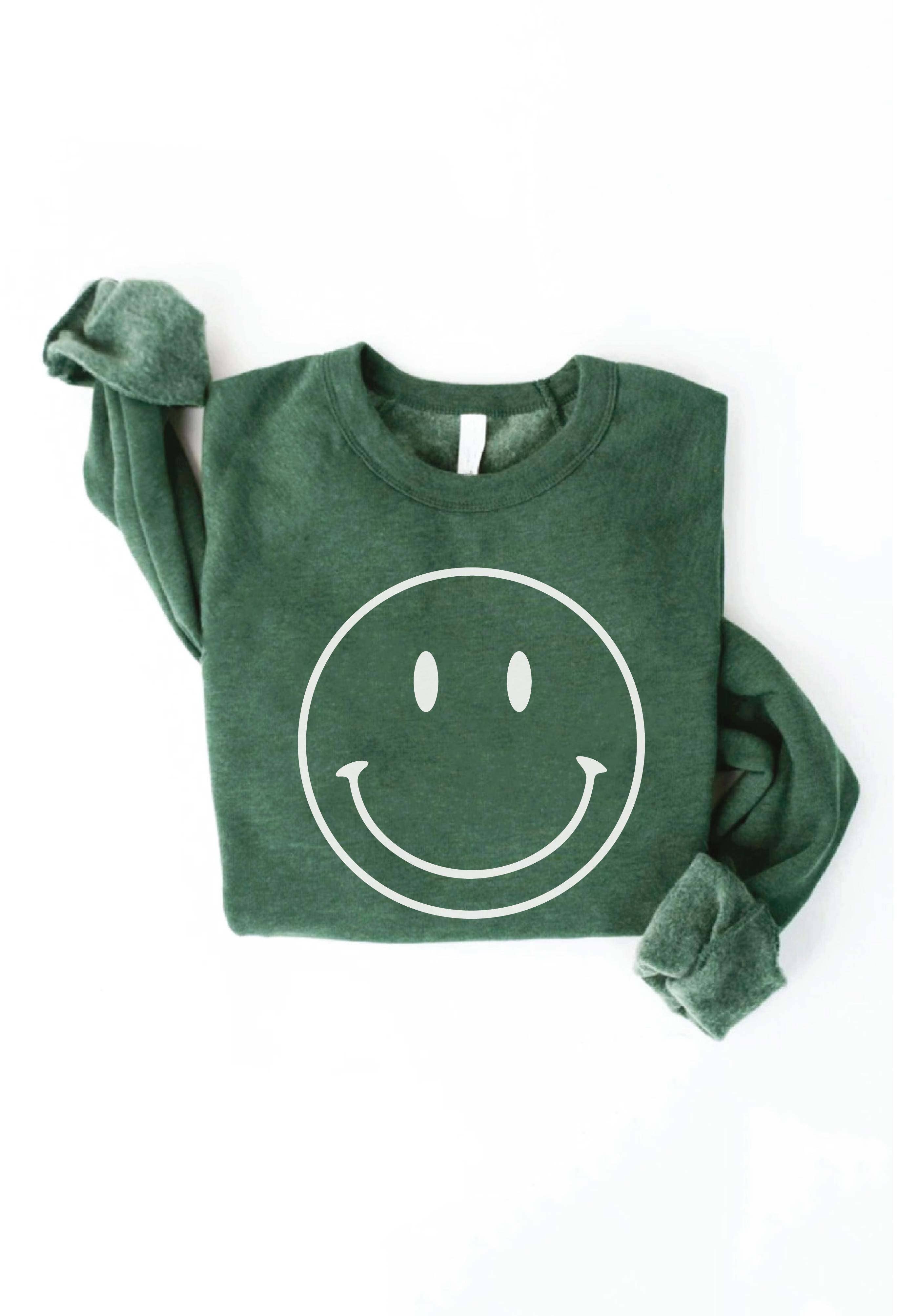 Smiley Face Sweater: Yellow sweater with a large smiley face design.