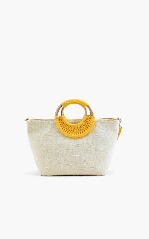 Embroidered handbag with lemons, oranges, and green leaves, featuring a round woven handle and yellow shoulder strap.