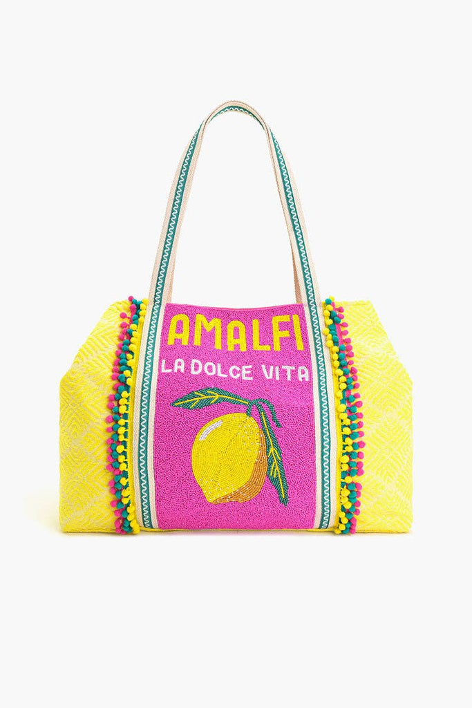Colorful beaded tote bag with "Amalfi La Dolce Vita" text, lemon motif, and yellow-pink fabric with green handles.
