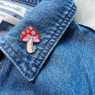 Daisy Mushroom Enamel Pin, featuring a captivating blend of mushroom and daisy design, radiating nature's playful charm.