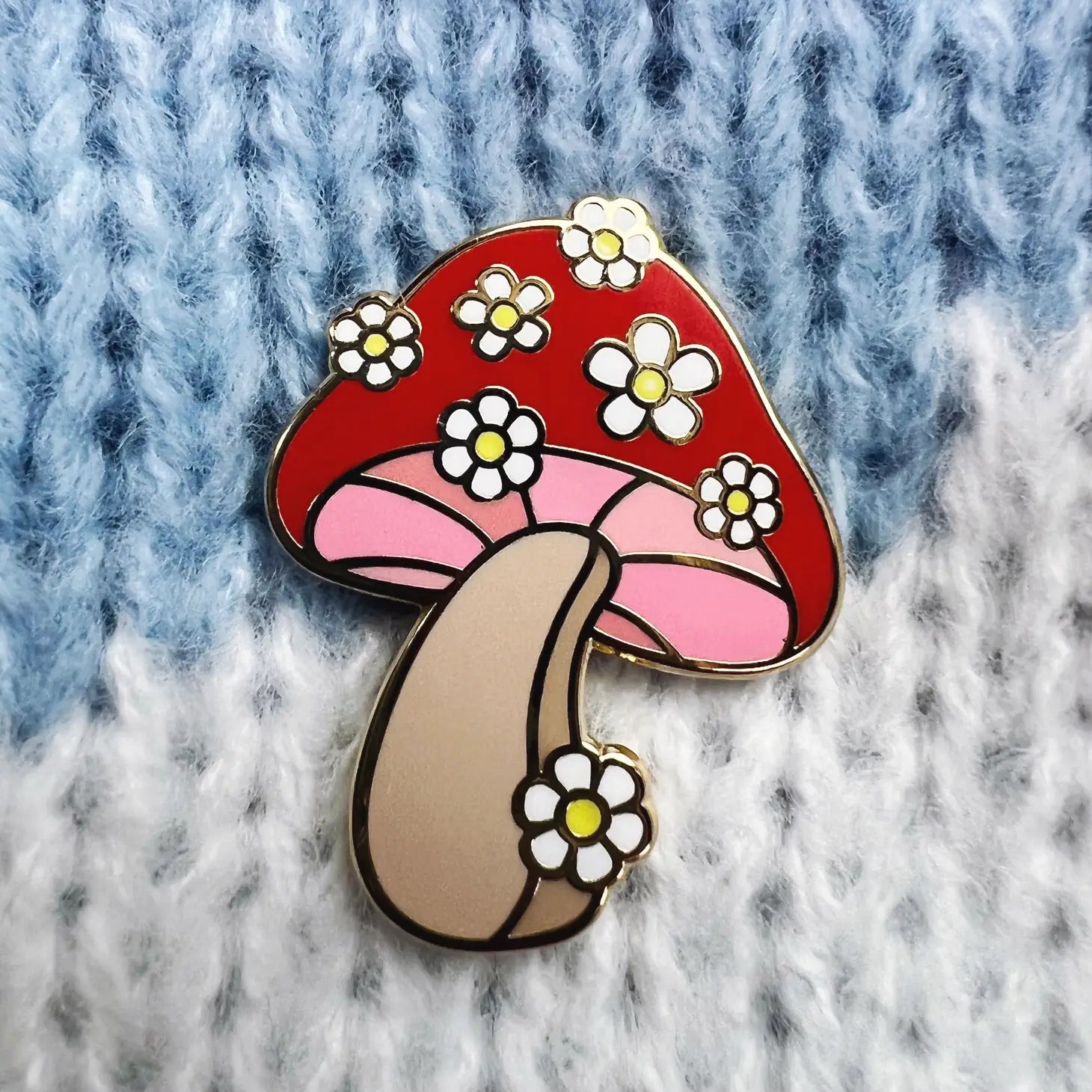 Daisy Mushroom Enamel Pin, featuring a captivating blend of mushroom and daisy design, radiating nature's playful charm.