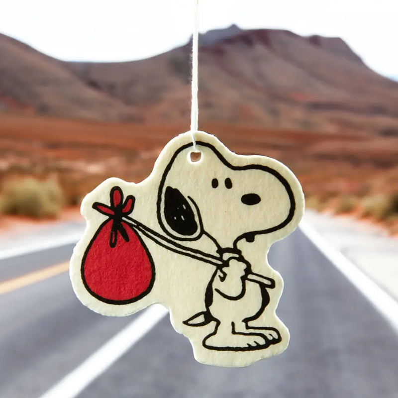 Peanuts Snoopy Nomad Air Freshener - Snoopy on a nomadic adventure. A delightful car accessory with a refreshing scent.