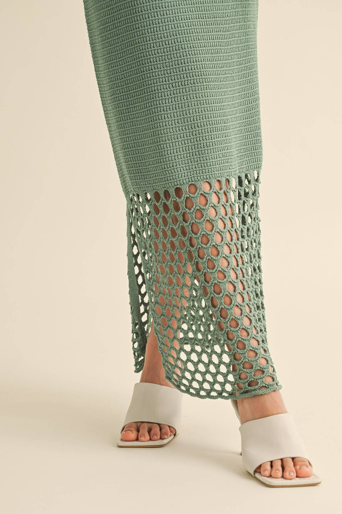 Model wearing the Maren Knitted Dress with delicate straps, mesh waist detail, and open-stitch hem.