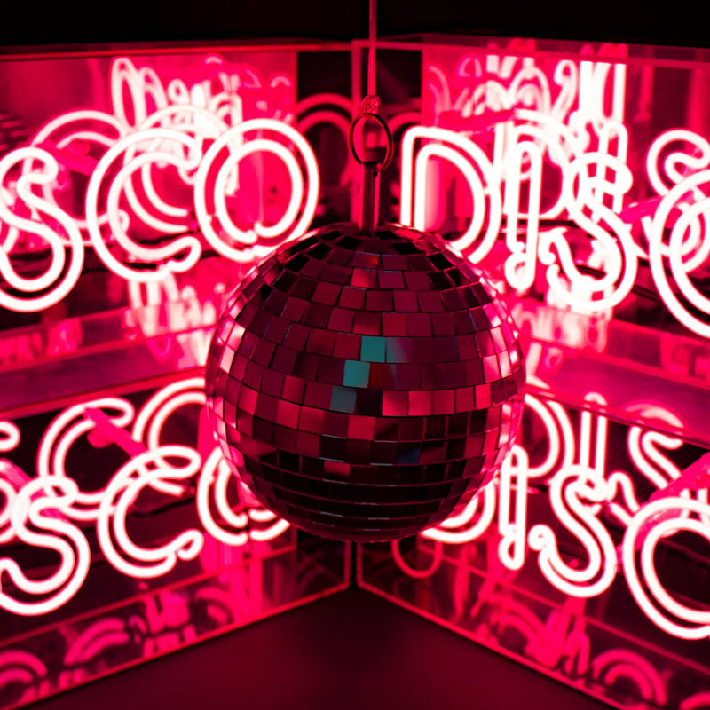 FORMA's Neon Pink Disco Light, a vibrant sign bringing the energetic glow of the dancefloor to your space.