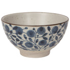 Ceramic bowl with blue floral pattern on a white background