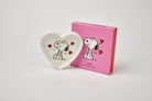 Heart-shaped ceramic trinket dish with a black-and-white illustration of a smiling beagle, accented by red hearts, alongside a matching pink gift box.