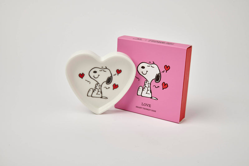 Heart-shaped ceramic trinket dish with a black-and-white illustration of a smiling beagle, accented by red hearts, alongside a matching pink gift box.