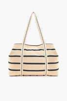 Beaded tote bag with sunset, palm tree, and ocean design, featuring black stripes, colorful pom-pom trim, and long handles.