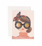 A stylish birthday card featuring an illustration of a woman with a floral headband and sunglasses that read "Happy Birthday Girl!"