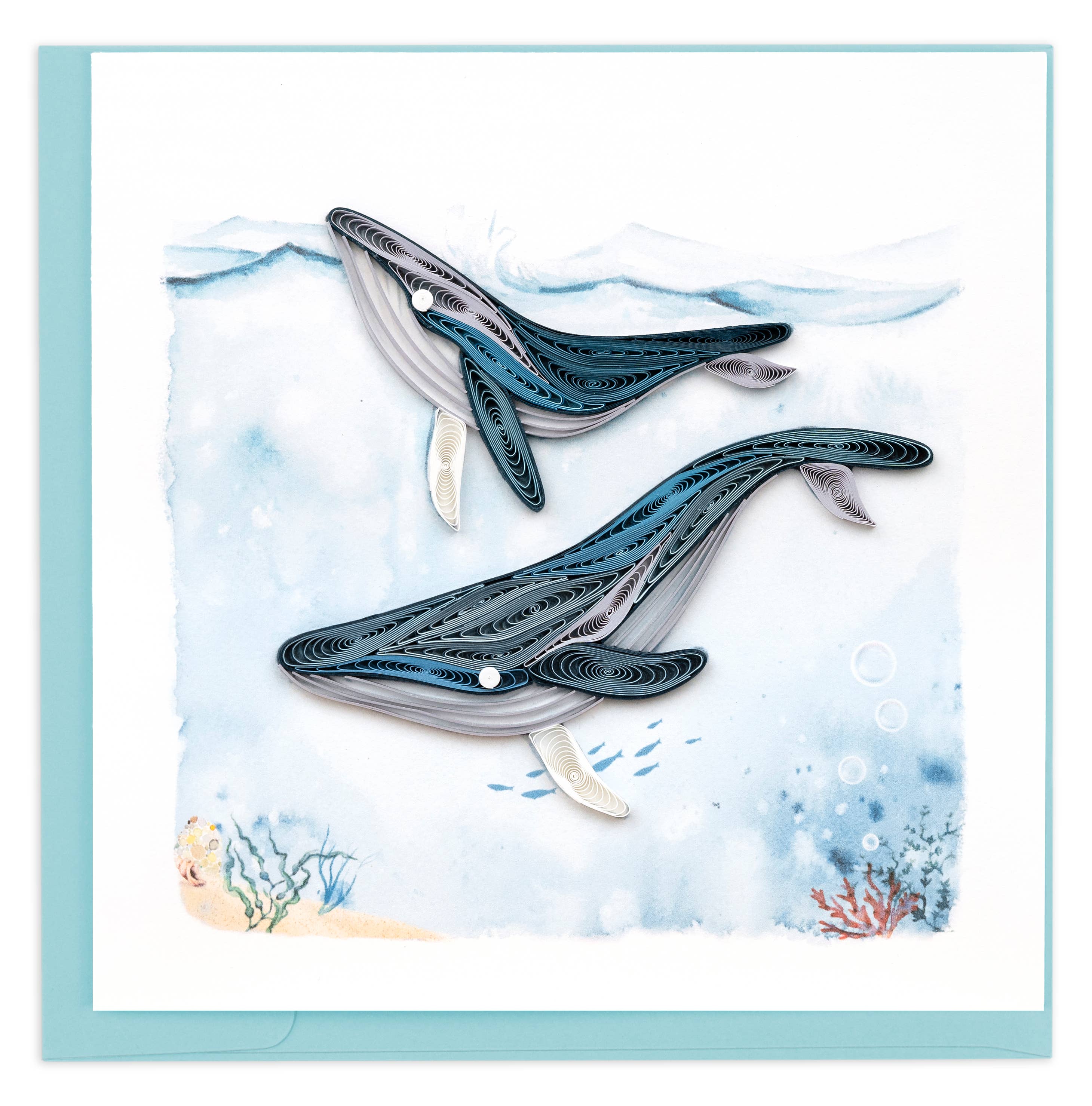 Quilled design of two whales on a watercolor background with a light blue border