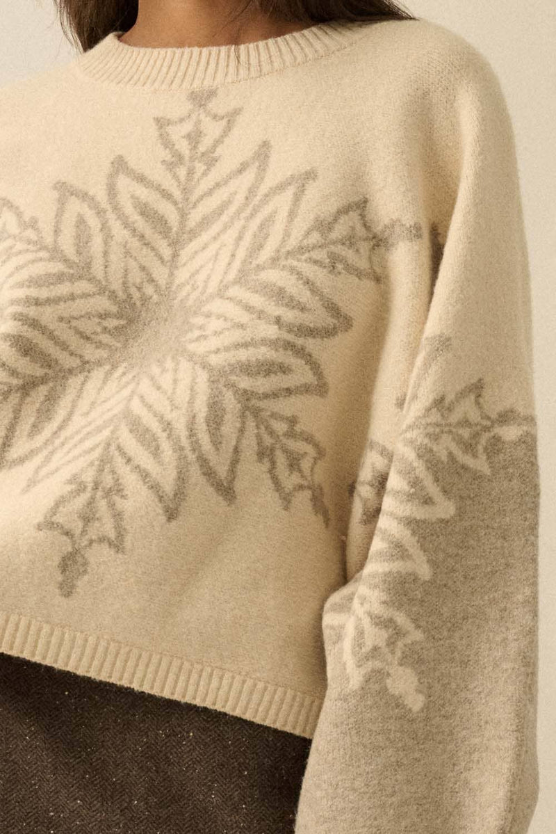 Oversized cream sweater with grey snowflake design.
