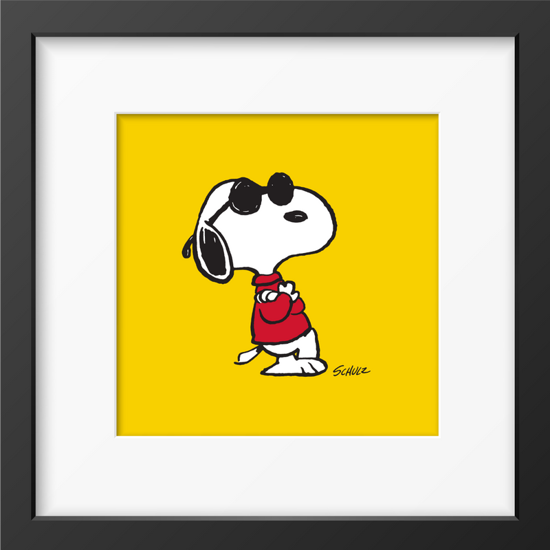 Framed artwork of Snoopy wearing sunglasses and a red sweater, set against a bright yellow background with a black frame.