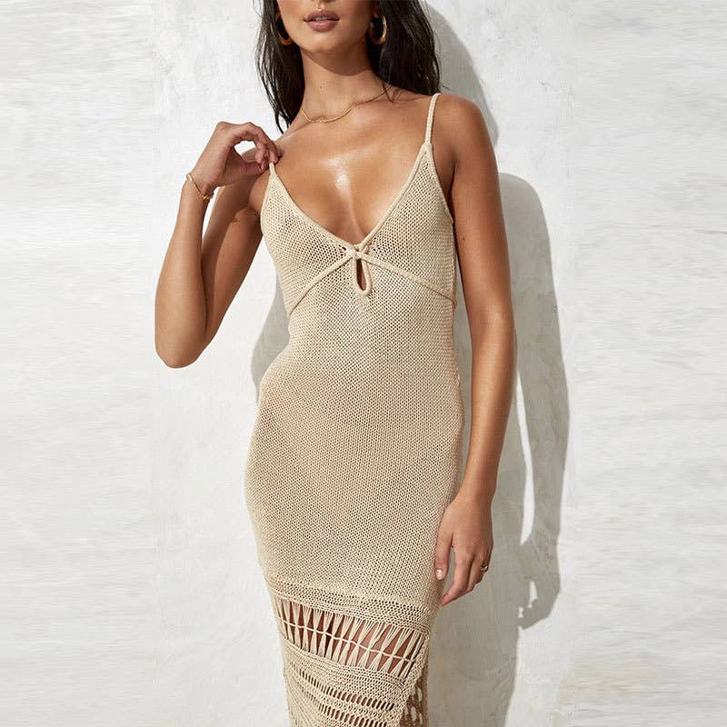 Woman wearing a Seaside Serenity Crochet Cover-Up Dress with a crochet design, adjustable spaghetti straps, and a fringe hem.