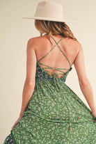 Panoramic view of the enchanting Deeane Ruffle Dress in vibrant green with floral pattern.