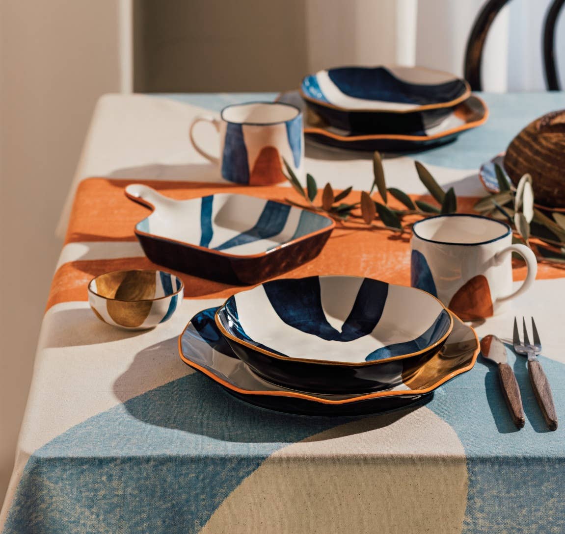 Small Canvas Bowl with abstract mustard yellow, navy blue, and light blue patterns.
