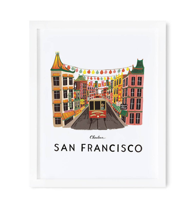 Framed San Francisco Chinatown print with colorful buildings, festive lanterns, and an iconic cable car on a bustling street.