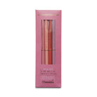 A set of four slim metal twist pens with gold foil phrases on each, packaged in a pink box.