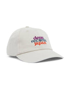 A white 'Dad' style baseball cap with 'deus ex machina japan' embroidered on the front.