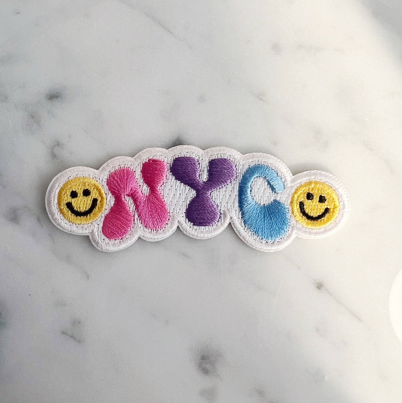 NYC Smiley Patch featuring a cheerful smiley face with the NYC skyline.
