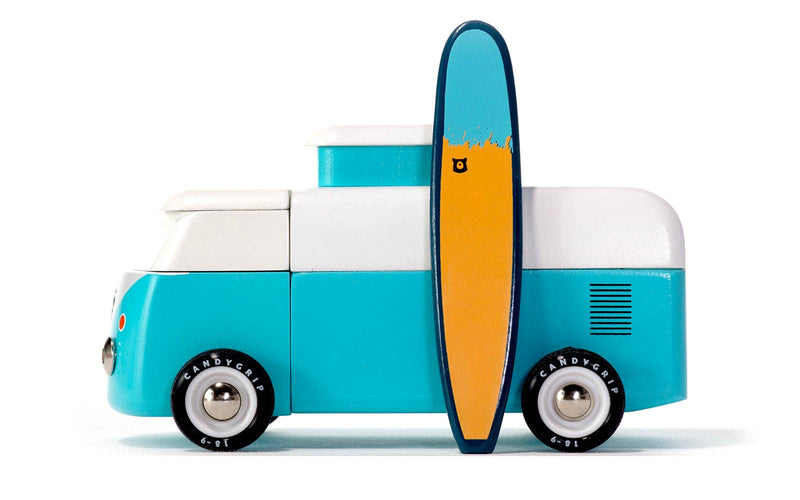 Toy truck with a surfboard on a white background