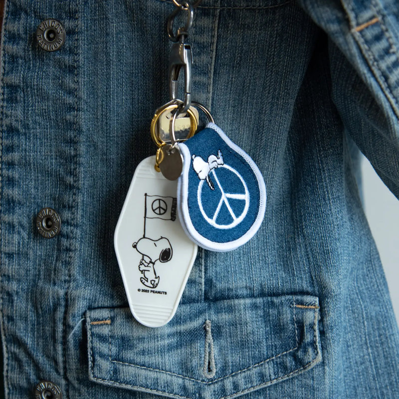 Peanuts Snoopy Peace Movement Key Tag - Snoopy promoting peace. A stylish and meaningful accessory for keys or bags.