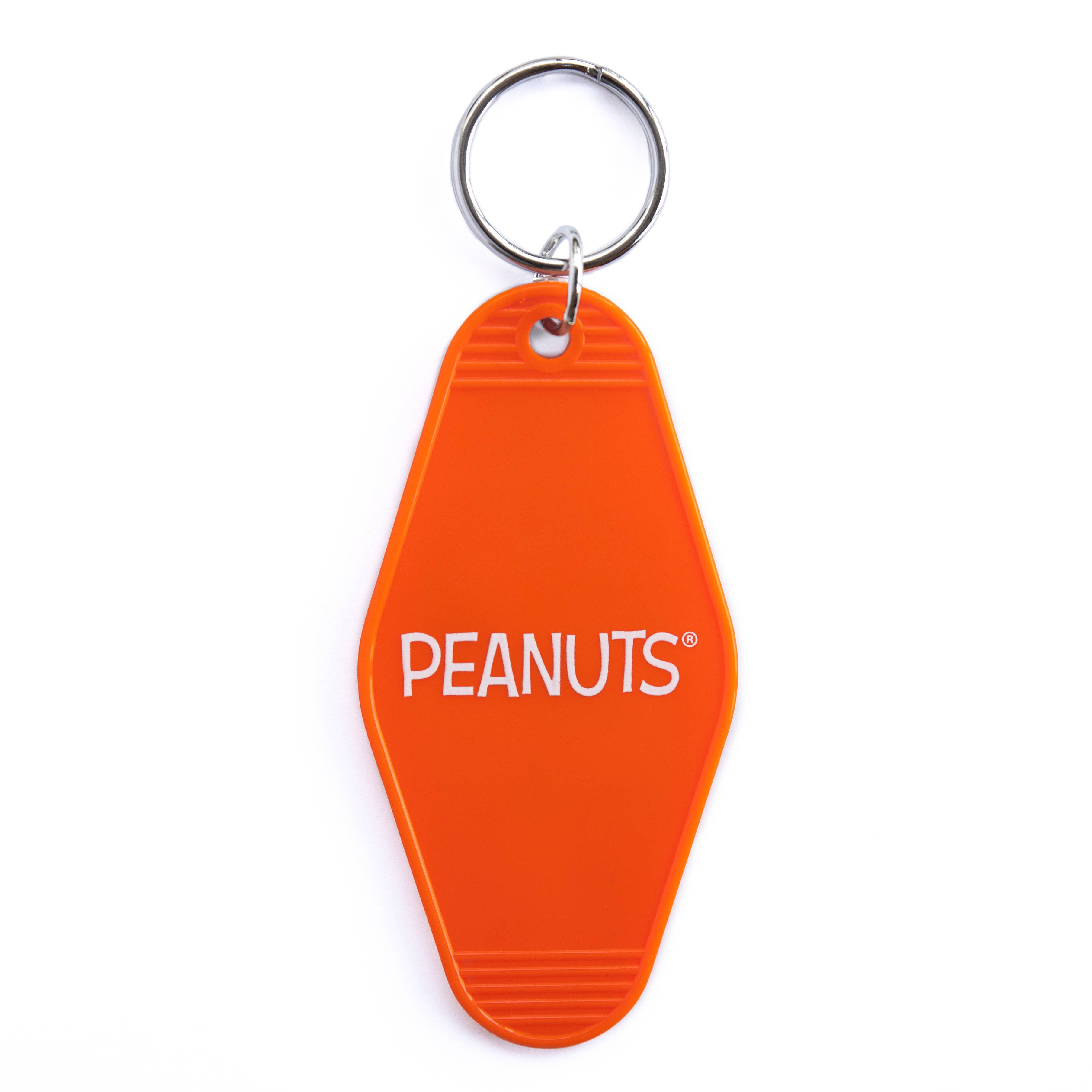 Peanuts® Snoopy Flower Bouquet Key Tag featuring Snoopy holding a bouquet of colorful flowers on a vibrant orange background.