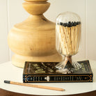 Black Helix Match Cloche with black-tipped matches, encased in a unique helix-patterned glass cloche.