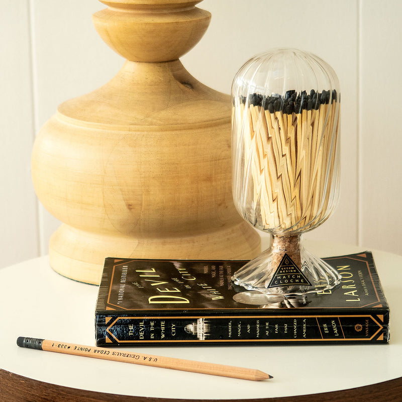 Black Helix Match Cloche with black-tipped matches, encased in a unique helix-patterned glass cloche.