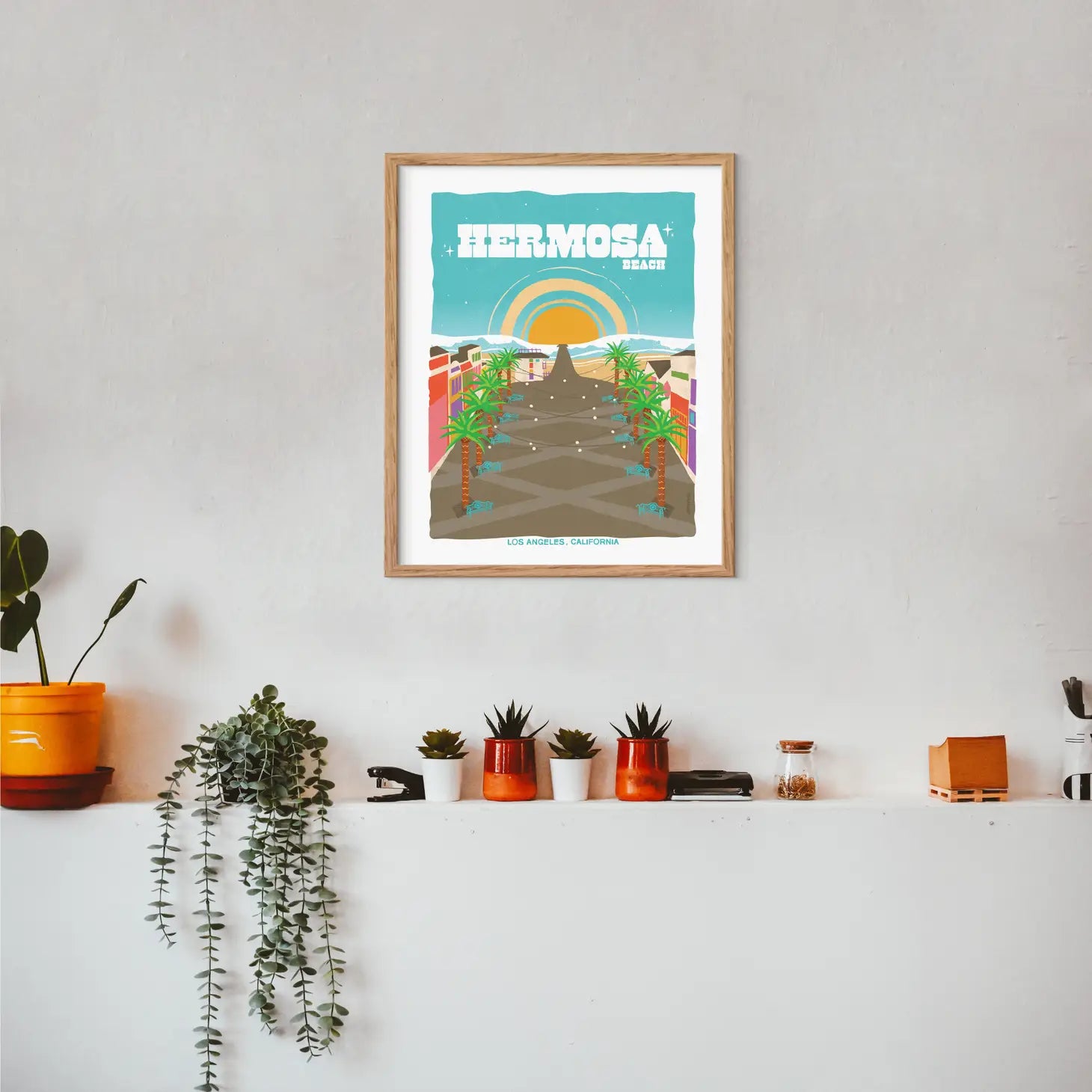 Picturesque print of Hermosa Beach's tranquil shoreline and iconic pier, echoing Southern California's beach charm.