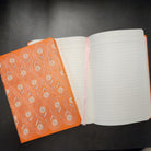 Close up of a Flower Embroided Notebook with intricate floral design on a soft cotton cover.