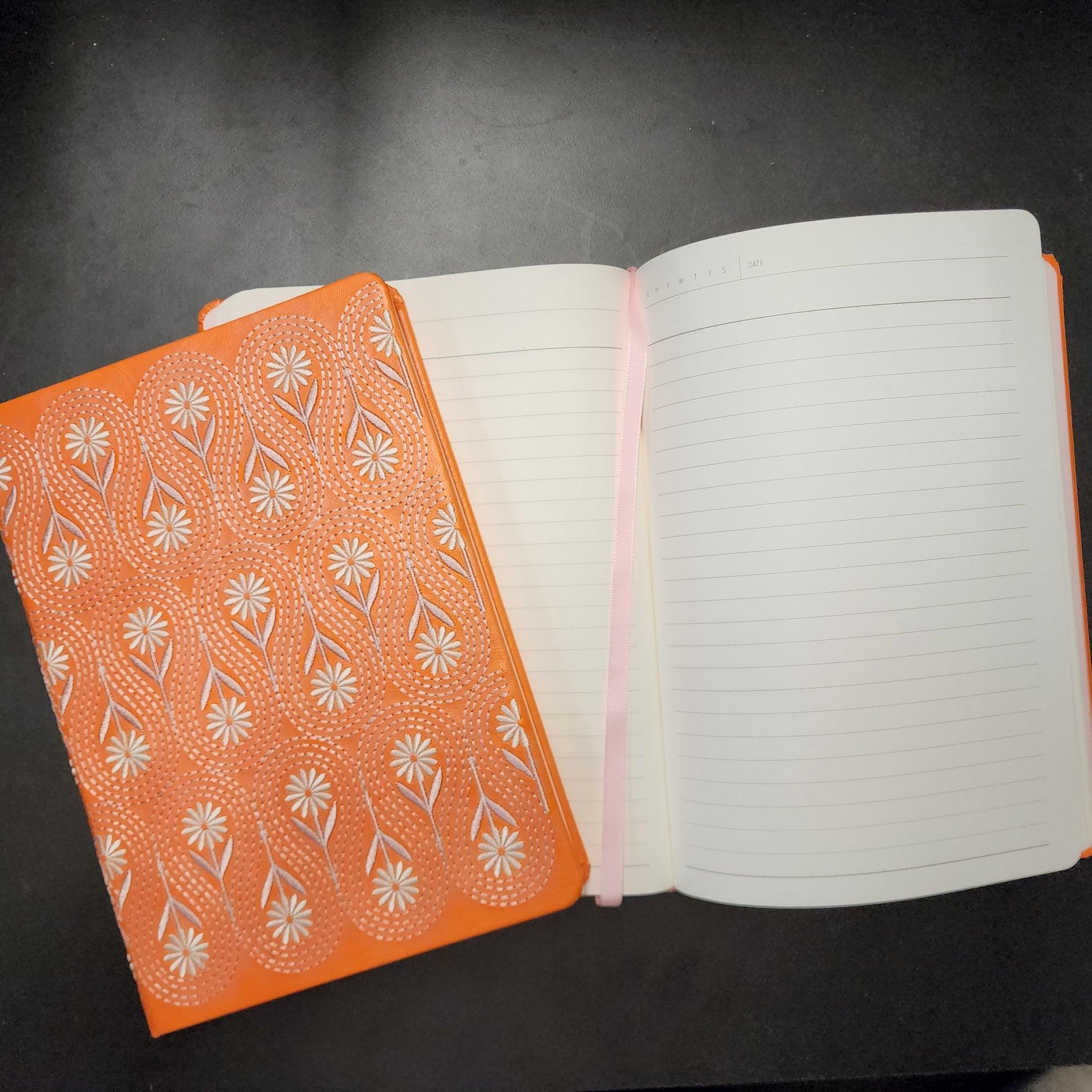 Close up of a Flower Embroided Notebook with intricate floral design on a soft cotton cover.