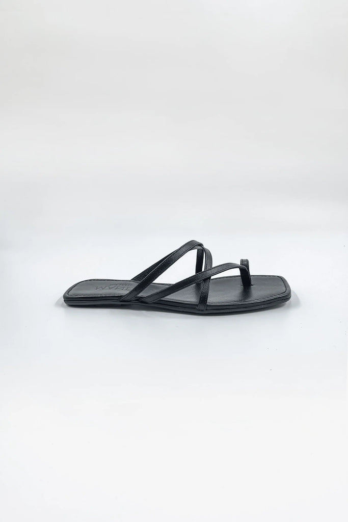 The Leandra Sandal displayed against a neutral background, highlighting its sleek design and convenient slip-on style.