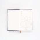Image of the 'Moon Phases Journal', showcasing a mesmerizing lunar-themed cover design.