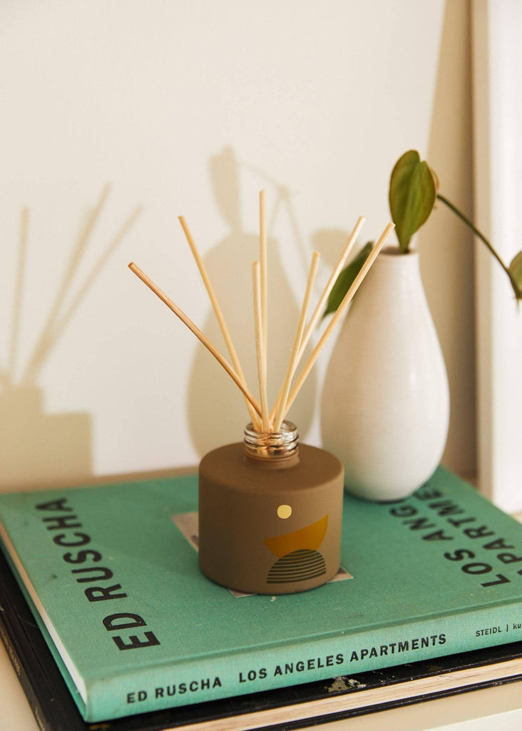 Moonrise Reed Diffuser with elegant bottle and natural reeds, diffusing a captivating fragrance.