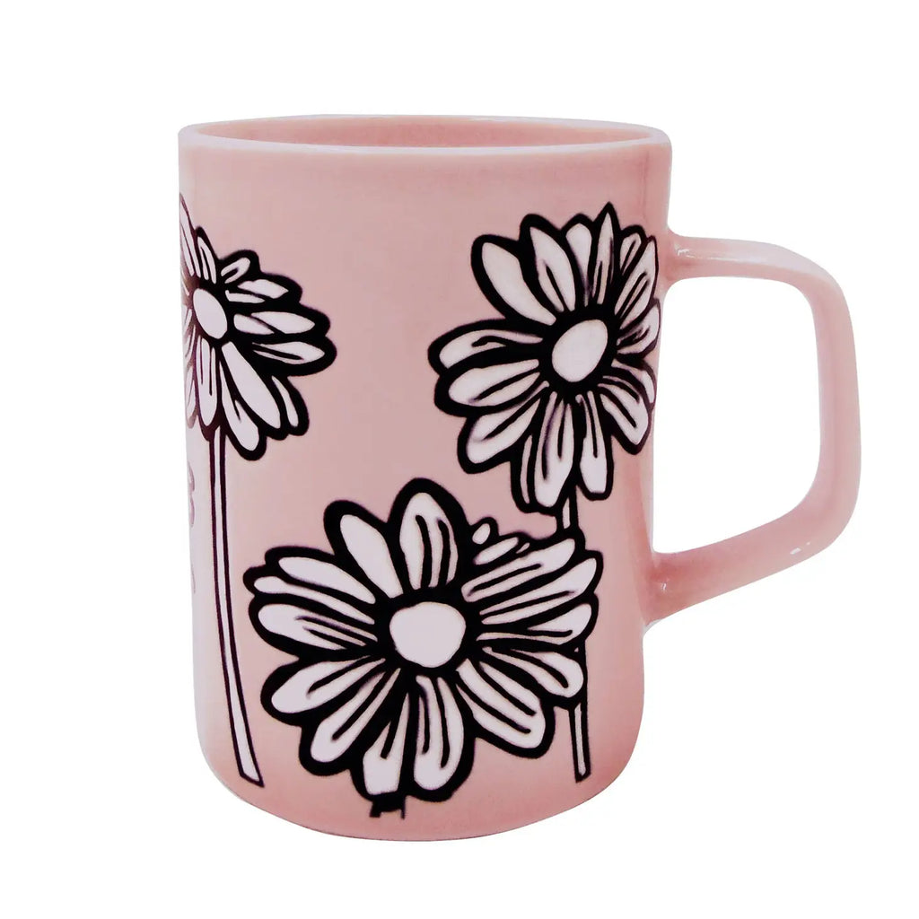 A Ceramic Daisy Mug with a beautiful daisy design, placed on a light-colored surface.