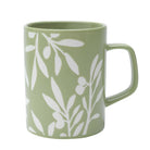 A Ceramic Olive Branch Mug with a delicate olive branch design, placed on a soft-hued surface.