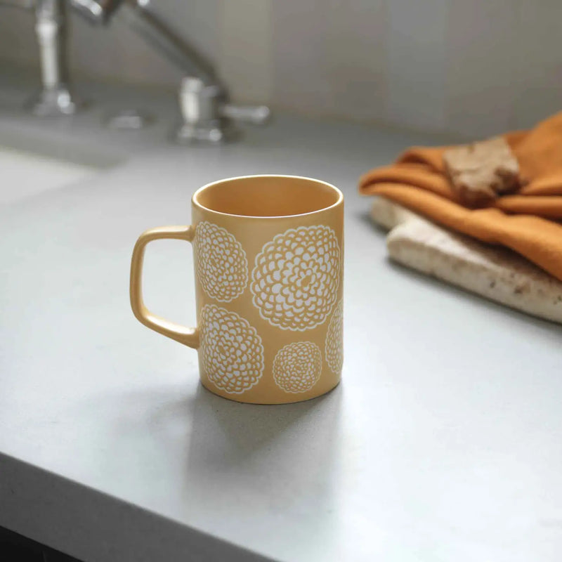 Vibrant Marigold Mug with a beautiful marigold design.